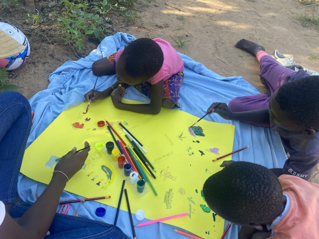 picture showing children drawing and painting different items on a chart